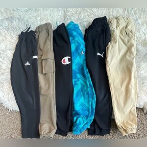 Boys Medium six pairs of pants bundle. Brands include Adidas, Jordan, Champion.